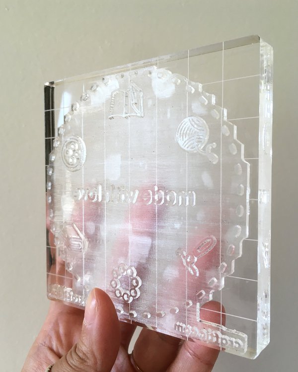 Closeup of acrylic clear stamp on acrylic block