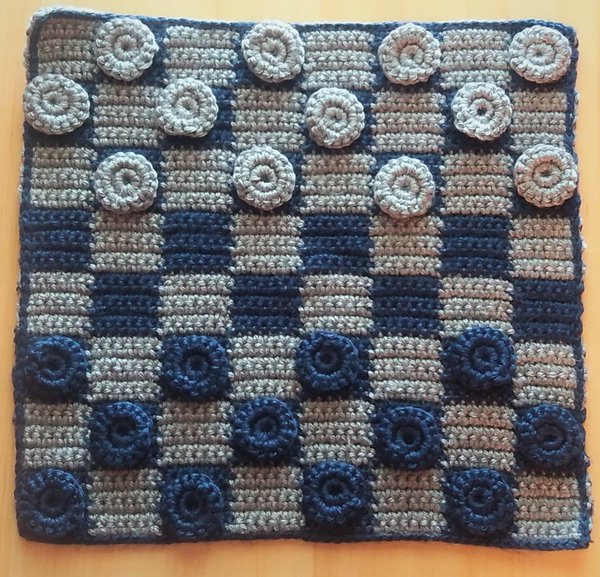 Crochet checkers game board and pieces in blue and gray