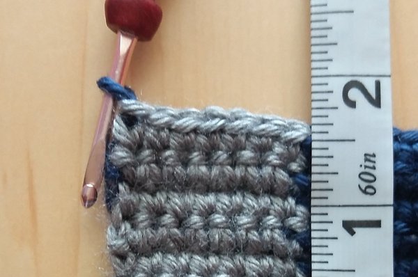 Ruler and crochet fabric and crochet hook adding new color