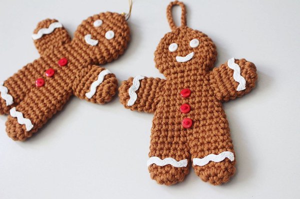 Two finished crochet gingerbread men ornaments