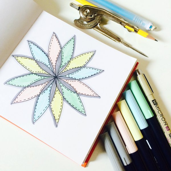 Mandala doodle in sketchbook with Tombow dual brush markers and compass