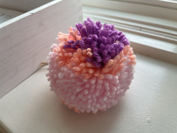 Pink and purple pom pom upclose