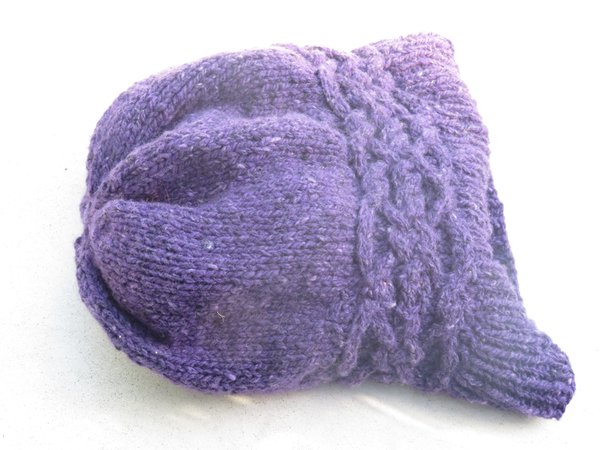 Knit purple tributary hat lying flat